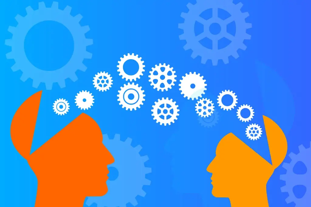 Illustration of two human profiles with open heads, one orange and one yellow, with white gears flowing between them against a blue background, symbolizing knowledge transfer, teaching, or communication.